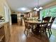 Eat-in kitchen featuring a breakfast bar, wood cabinets, and access to the backyard at 2002 Grey Fox Ct, Martinsville, IN 46151