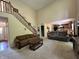 Open-concept living area with a staircase and views of the kitchen at 2002 Grey Fox Ct, Martinsville, IN 46151
