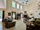 Open living room with a fireplace, high ceilings, lots of natural light, and comfortable seating area at 2002 Grey Fox Ct, Martinsville, IN 46151