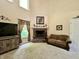 Inviting living room with a cozy fireplace and neutral color palette at 2002 Grey Fox Ct, Martinsville, IN 46151