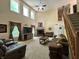 Inviting living room with vaulted ceilings, fireplace, and staircase access at 2002 Grey Fox Ct, Martinsville, IN 46151