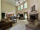 Spacious living room boasts a fireplace, plush seating, and lots of natural light at 2002 Grey Fox Ct, Martinsville, IN 46151