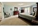 Spacious main bedroom featuring a wooden bed frame, light blue walls, and lots of furniture at 2002 Grey Fox Ct, Martinsville, IN 46151