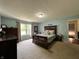 Serene main bedroom with a large window and a comfortable bed at 2002 Grey Fox Ct, Martinsville, IN 46151