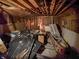 Unfinished basement with exposed insulation, wires, debris and exposed ceiling beams at 2074 W 300 S, Shelbyville, IN 46176