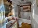 Bathroom features a vanity with granite top, toilet, and tub with shower at 2074 W 300 S, Shelbyville, IN 46176