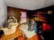 Bedroom with dark wall and disheveled bed and a window at 2074 W 300 S, Shelbyville, IN 46176