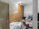 Bedroom showing unfinished walls, exposed studs, and a pile of clothes at 2074 W 300 S, Shelbyville, IN 46176