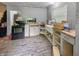 Unfinished kitchen featuring an undermount sink, oven, microwave, and gray cabinets at 2074 W 300 S, Shelbyville, IN 46176