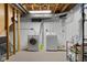 Basement laundry room with washer and dryer hookups on tiled floor at 2233 Washington St, Columbus, IN 47201
