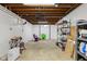 Spacious basement with painted walls, exposed ceiling, and unique decor at 2233 Washington St, Columbus, IN 47201