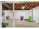 Unfinished basement with painted walls, exposed ceiling, and painted support beam at 2233 Washington St, Columbus, IN 47201