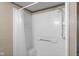Shower with white tiled walls and a chrome shower head at 2233 Washington St, Columbus, IN 47201
