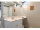 Bathroom with a white vanity, large mirror and tile shower and tub at 2233 Washington St, Columbus, IN 47201