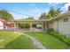 Covered carport leading from backyard to home with grassy area at 2233 Washington St, Columbus, IN 47201