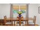 Dining area featuring a wooden table, seating for four, and natural light at 2233 Washington St, Columbus, IN 47201
