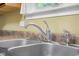 Close-up of a stainless steel kitchen sink and faucet, highlighting the clean and functional design at 2233 Washington St, Columbus, IN 47201
