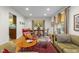 Bright living room with a hardwood floor, dining table, and comfortable seating arrangements at 2233 Washington St, Columbus, IN 47201
