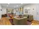 Open-concept living area with hardwood floors, dining space, and neutral color palette at 2233 Washington St, Columbus, IN 47201