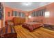 Comfortable bedroom with hardwood floors, soft lighting, and warm-toned walls offers a cozy retreat at 2233 Washington St, Columbus, IN 47201