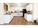 Well-lit kitchen featuring white cabinets, modern appliances, and ample countertop space at 2388 Cedarmill Dr, Franklin, IN 46131