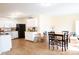 Open kitchen and dining area, featuring white cabinets and modern appliances at 2388 Cedarmill Dr, Franklin, IN 46131