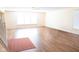 Bright living room features beautiful hardwood floors, neutral paint, and bright, natural light at 2388 Cedarmill Dr, Franklin, IN 46131