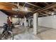 Spacious unfinished basement with exposed wood beams, and concrete columns at 2433 E 16Th St, Indianapolis, IN 46201