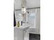 Clean bathroom featuring a pedestal sink, updated fixtures, and a shower-tub combo at 2433 E 16Th St, Indianapolis, IN 46201