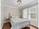 A cozy bedroom with a tufted headboard, neutral tones, and great natural light at 2433 E 16Th St, Indianapolis, IN 46201