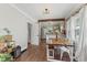 Cozy dining room featuring a wood beam, access to kitchen, and access to the living room at 2433 E 16Th St, Indianapolis, IN 46201