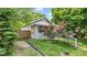 Charming home with well-manicured front yard, lovely landscaping, and a welcoming entrance at 2433 E 16Th St, Indianapolis, IN 46201