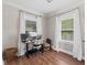 Bright home office with hardwood floors, neutral paint, and lots of natural light at 2433 E 16Th St, Indianapolis, IN 46201