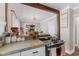 Bright kitchen with concrete countertops, stainless steel appliances, and an open layout at 2433 E 16Th St, Indianapolis, IN 46201