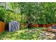 Fenced backyard featuring a storage shed and firepit at 29 Northview Dr, Danville, IN 46122