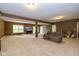Finished basement featuring neutral carpet, a sofa, and an entertainment area at 29 Northview Dr, Danville, IN 46122