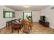 Inviting living room featuring wood floors, comfortable seating, and natural light from large windows at 29 Northview Dr, Danville, IN 46122