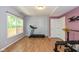 Bright workout room featuring exercise equipment and wood floor at 29 Northview Dr, Danville, IN 46122