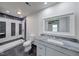 Modern bathroom showcasing shower, toilet, and white vanity with gray marble countertop at 32 Downing Dr, Trafalgar, IN 46181