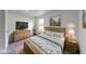 Bedroom with wood furniture, light blue bedding, neutral colored walls, and natural lighting at 32 Downing Dr, Trafalgar, IN 46181