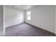 Bright, empty bedroom featuring clean neutral walls and gray carpet at 32 Downing Dr, Trafalgar, IN 46181