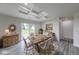 Bright dining room featuring a stylish table, chairs and a decorative area rug at 32 Downing Dr, Trafalgar, IN 46181