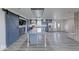 Open kitchen featuring gray cabinetry, stainless steel appliances, and a spacious island with ample countertop at 32 Downing Dr, Trafalgar, IN 46181