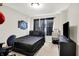 Modern bedroom with dark bedding and accents at 3428 Thomas Jefferson St, Westfield, IN 46074