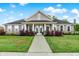 Charming home exterior with manicured lawn and inviting entrance showcasing modern architecture and landscaping at 3428 Thomas Jefferson St, Westfield, IN 46074