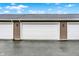 Attached two-car garage with white doors and tan siding, providing convenient parking and storage at 3428 Thomas Jefferson St, Westfield, IN 46074