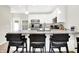 Bright, modern kitchen with stainless steel appliances, white cabinetry, and breakfast bar seating at 3428 Thomas Jefferson St, Westfield, IN 46074