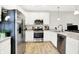 Modern kitchen featuring stainless steel appliances, a breakfast bar, and ample counter space at 3428 Thomas Jefferson St, Westfield, IN 46074