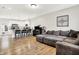 Open concept living space with modern finishes, seamlessly connecting the living room and kitchen at 3428 Thomas Jefferson St, Westfield, IN 46074