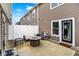 Rear view of outdoor patio with fire pit, seating, and privacy fence at 3428 Thomas Jefferson St, Westfield, IN 46074